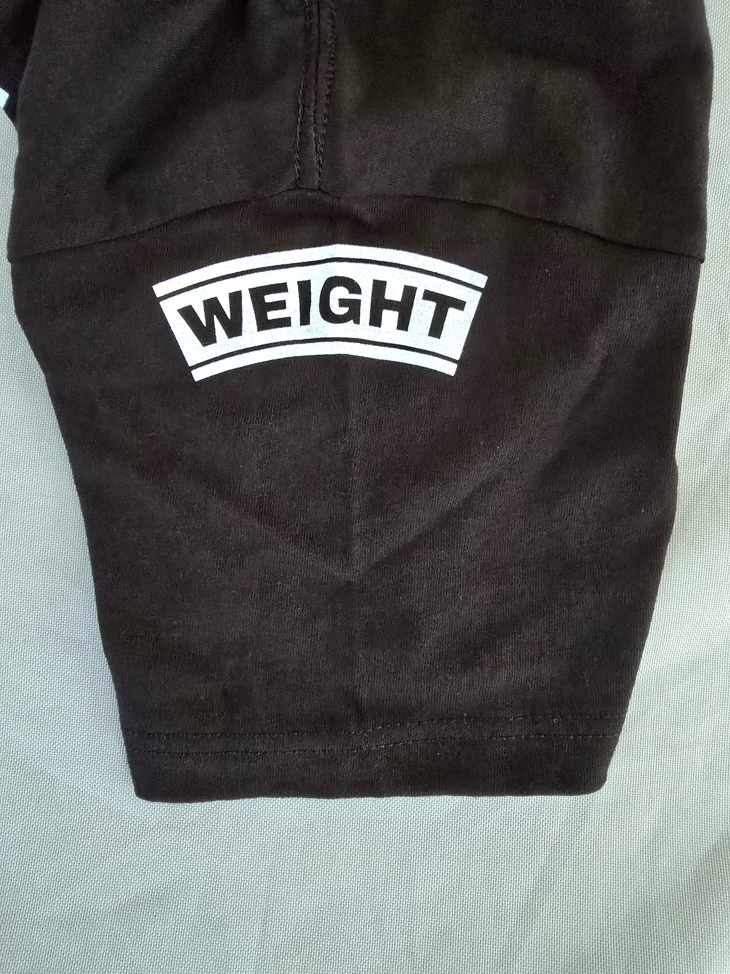 Weight on Shoulders / Exhausted Not Defeated Short Sleeve T-Shirt (Black)
